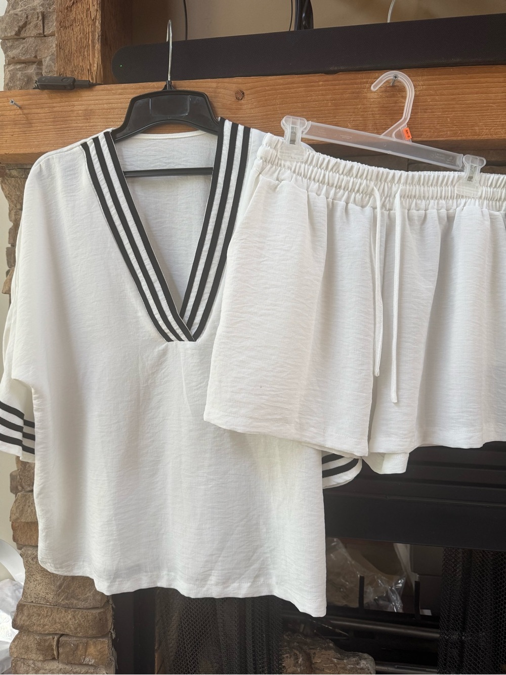 White shorts set with black trim v-neck top relaxed travel lounge